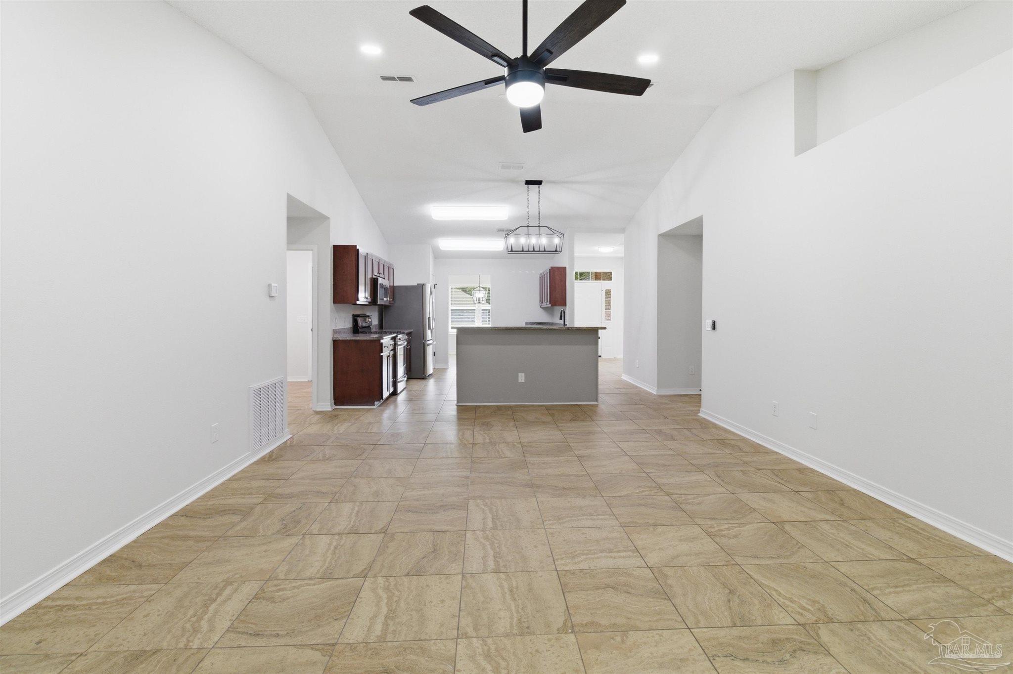 1866 Wareham Way Cantonment, FL 32533 - Photo 10 of 33 a view of a kitchen with a sink and a refrigerator