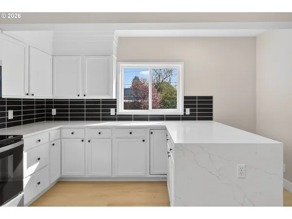 a view of cabinets with wooden floor