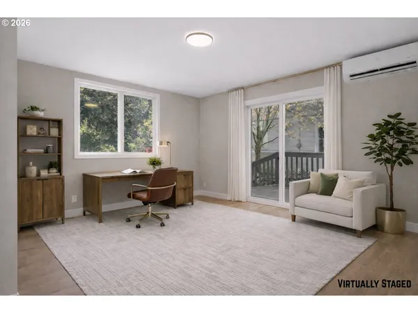 a living room with furniture floor to ceiling window and a potted plant
