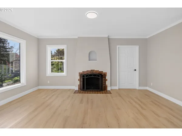 a big room with closet and a fireplace