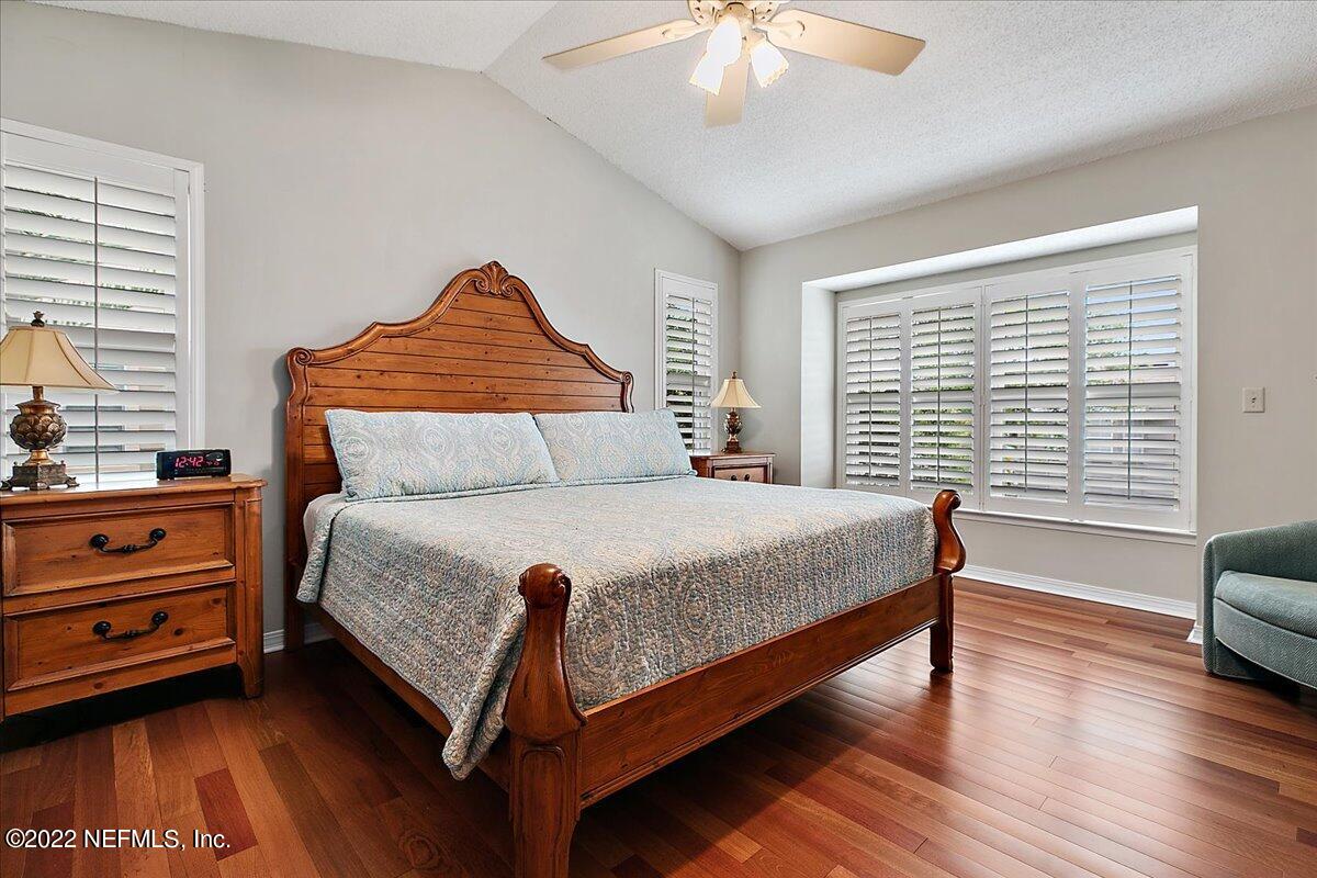 1921 Seminole Road Atlantic Beach, FL 32233 - Photo 14 of 27 a bedroom with a bed and a night stand