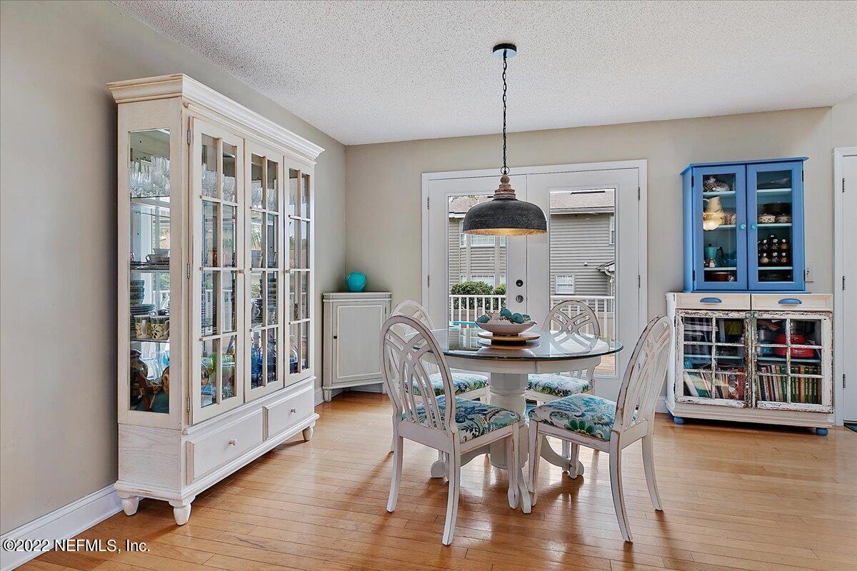 1921 Seminole Road Atlantic Beach, FL 32233 - Photo 6 of 27 a view of a dining room with furniture window and wooden floor