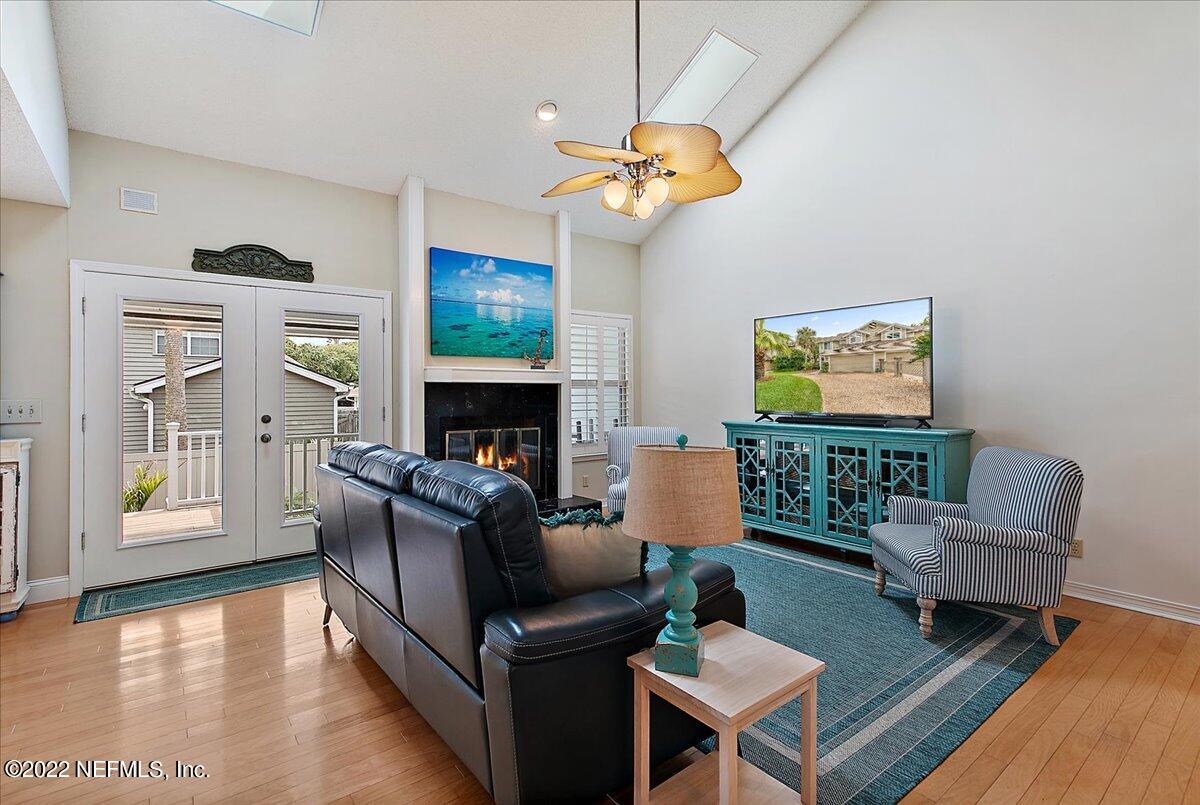 1921 Seminole Road Atlantic Beach, FL 32233 - Photo 8 of 27 a living room with furniture a fireplace and a flat screen tv