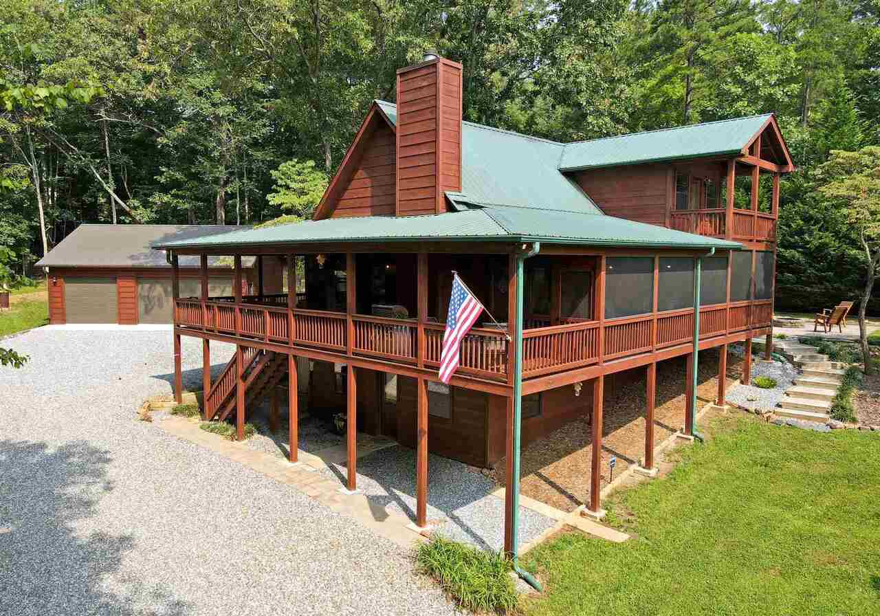 110 Nicholson Farm Road Blairsville, GA 30512 - Photo 1 of 1 a view of a wooden deck and a backyard