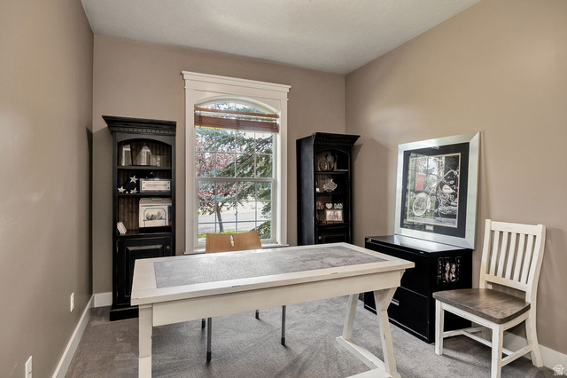 288 525 South Providence, UT 84332 - Photo 24 of 71 Room with a single arched window featuring white trim and wood-finish blinds