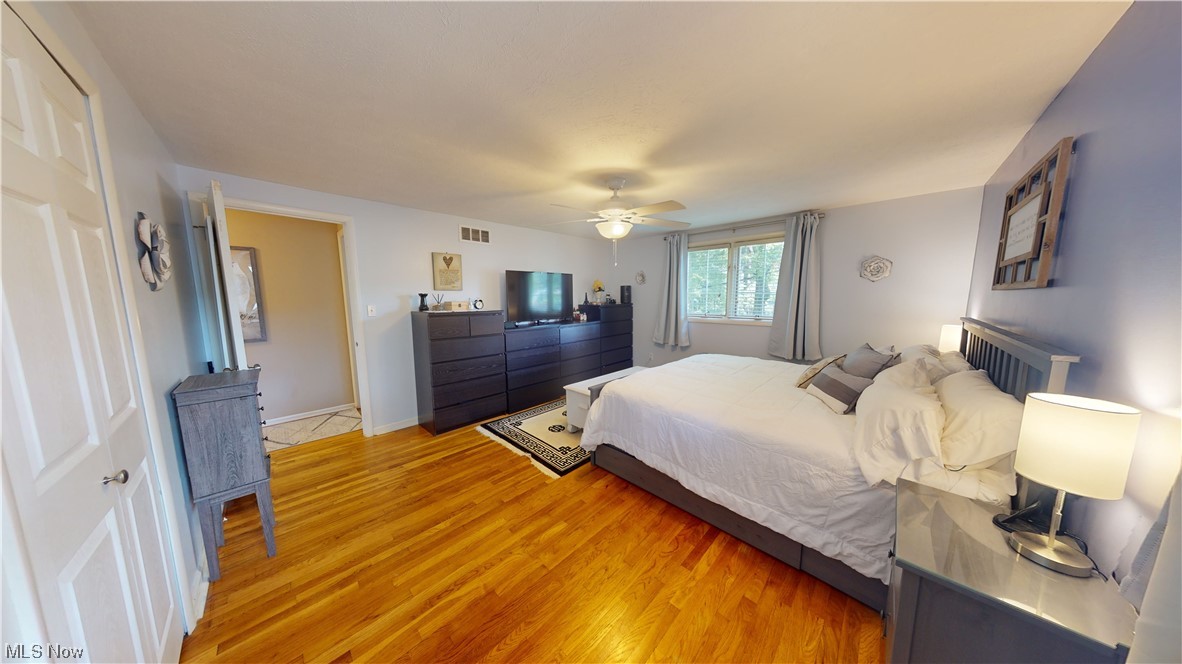 1071 Roland Road Lyndhurst, OH 44124 - Photo 21 of 30 Bedroom with light hardwood floors and ceiling fan
