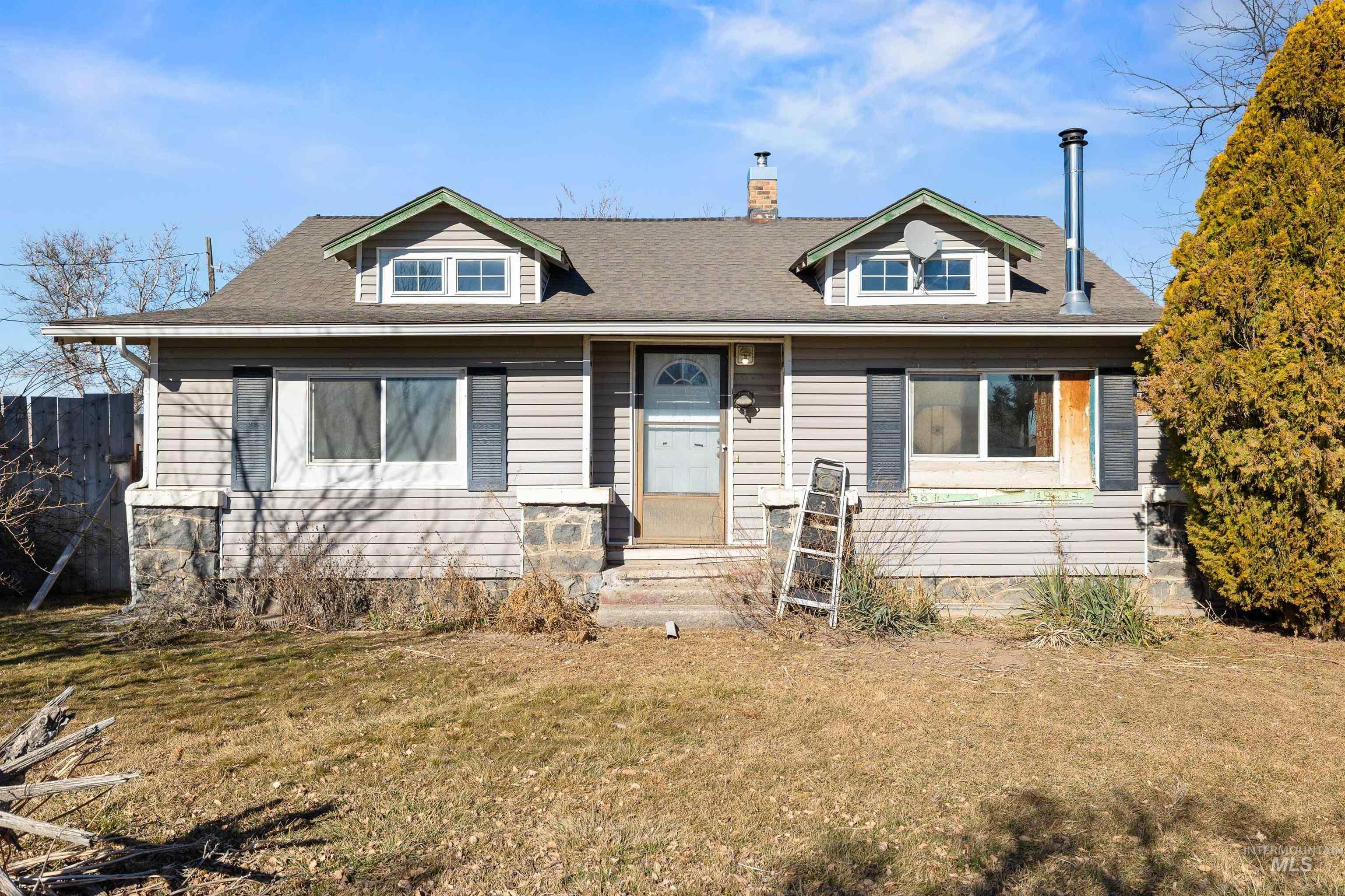 1898 East 3700th Street North Filer, ID 83328 - Photo 14 of 40 View of front of home with a front yard, a chimney, and a shingled roof
