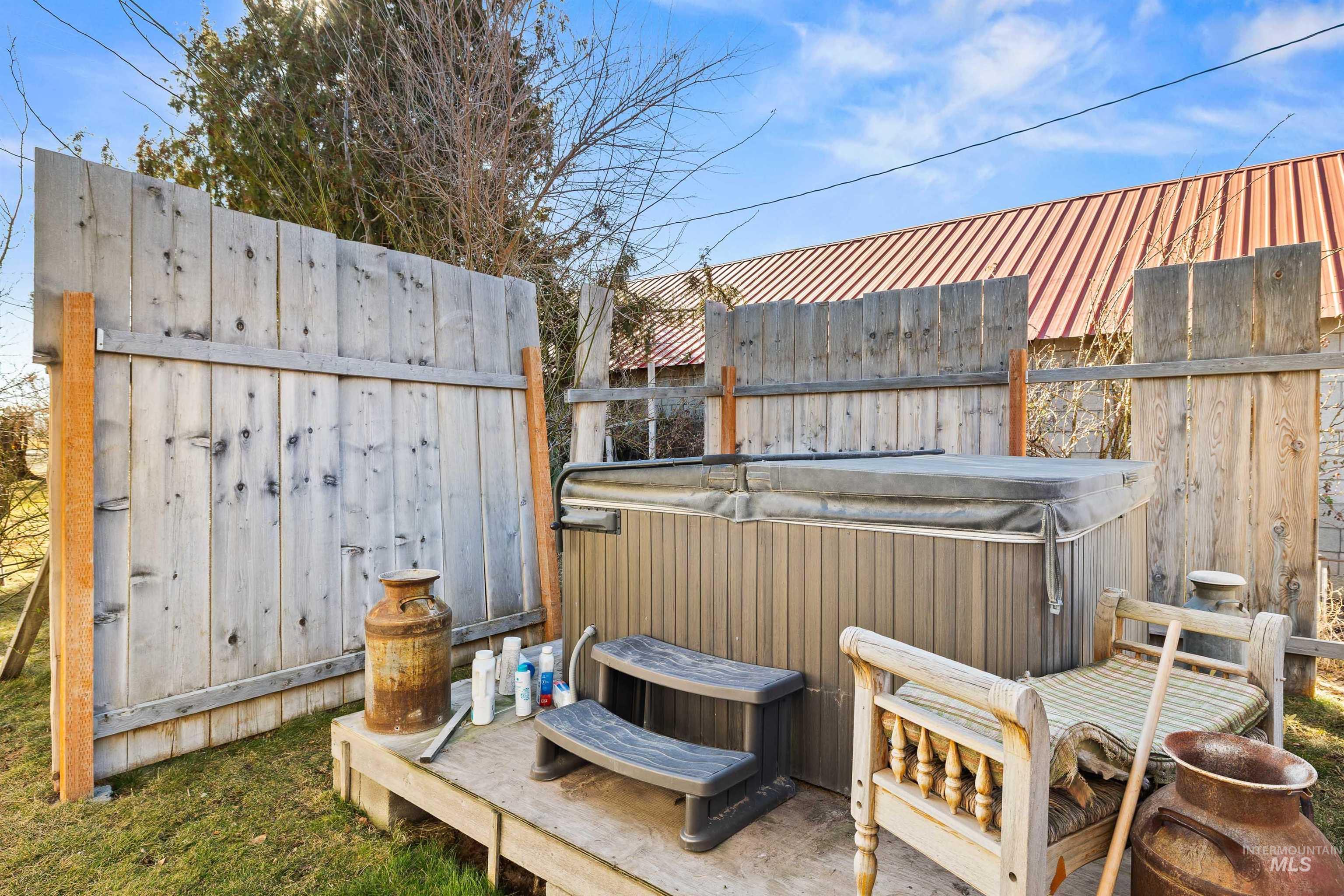 1898 East 3700th Street North Filer, ID 83328 - Photo 17 of 40 Wooden deck featuring a hot tub