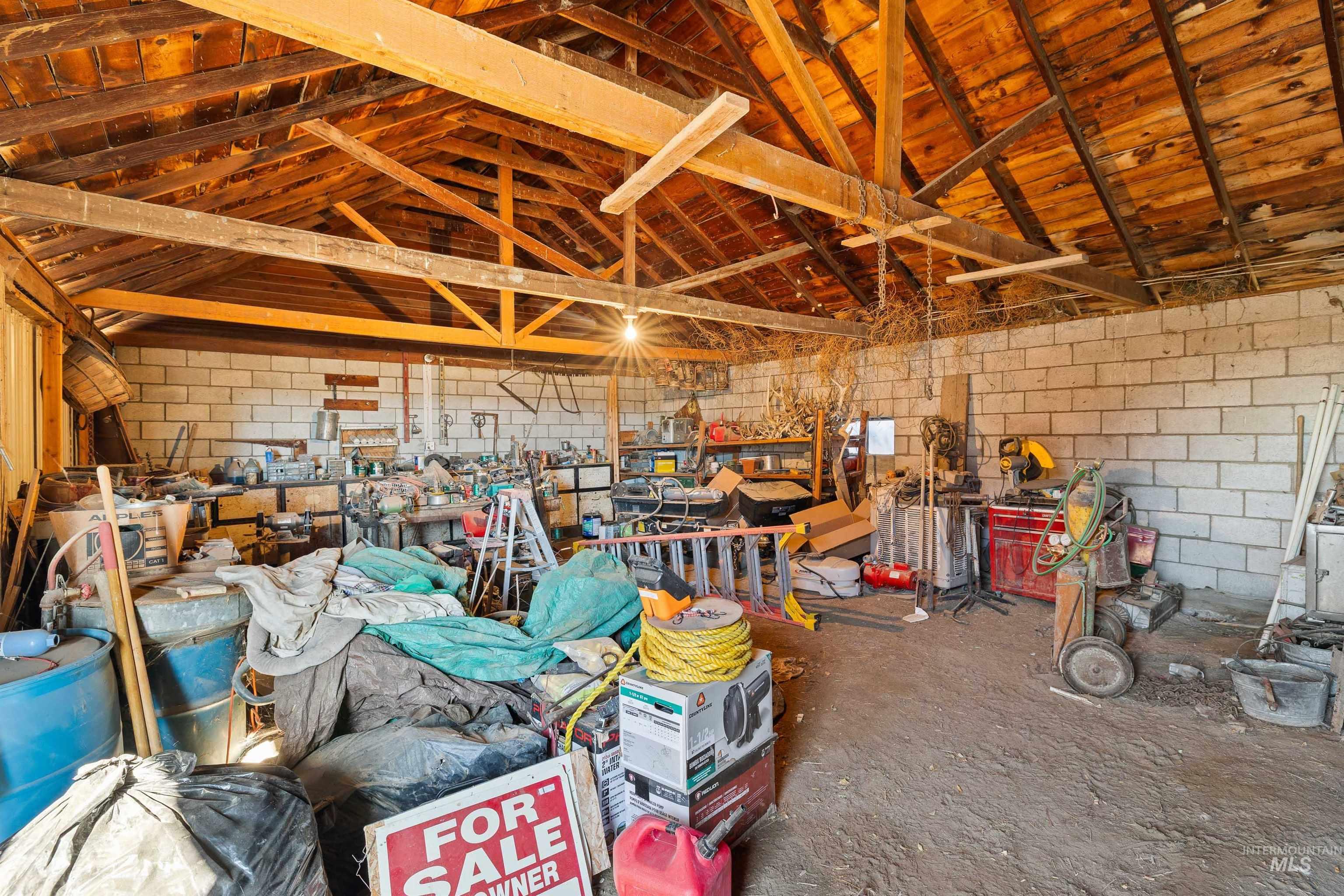 1898 East 3700th Street North Filer, ID 83328 - Photo 21 of 40 Misc room featuring concrete block wall and a high ceiling