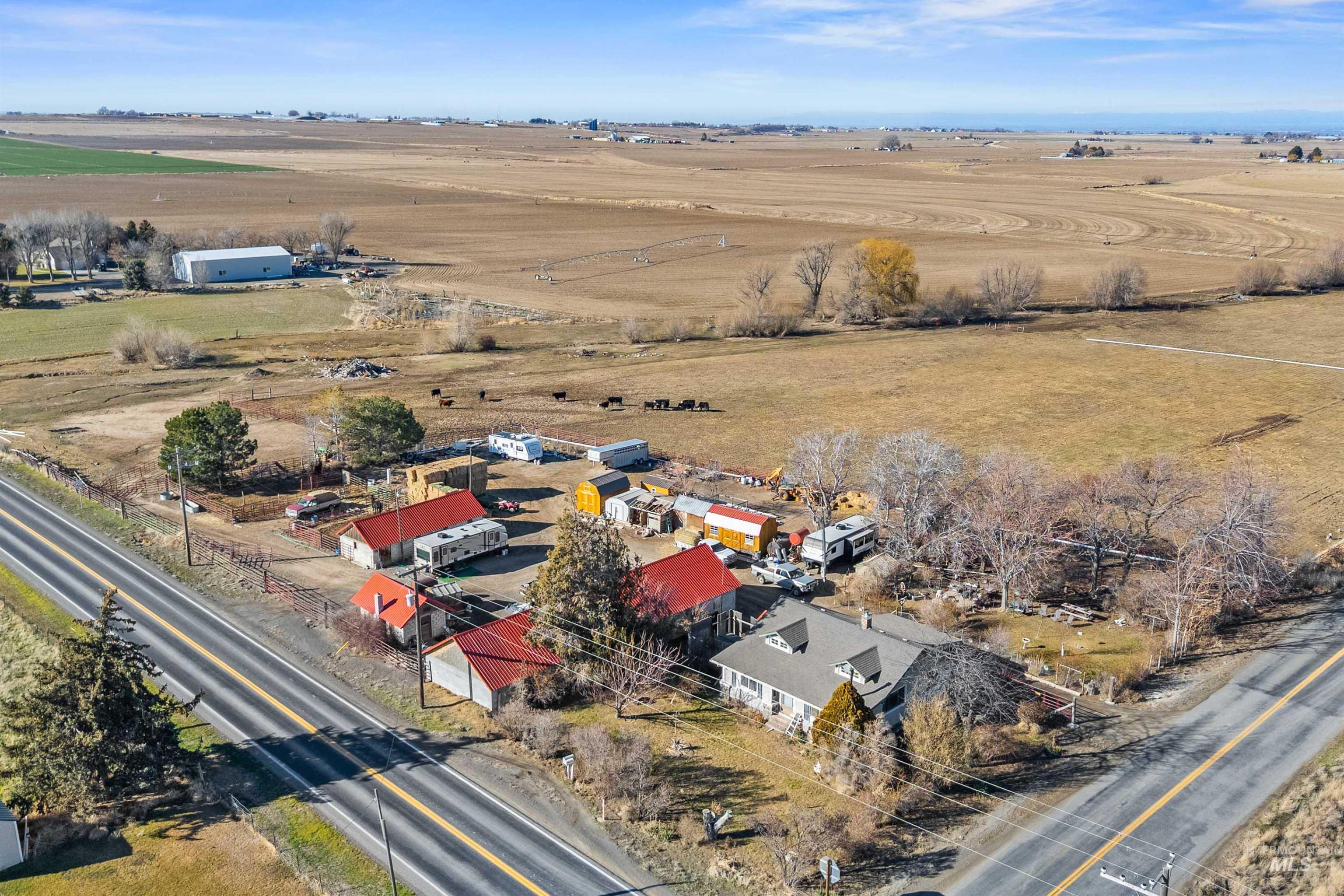 1898 East 3700th Street North Filer, ID 83328 - Photo 33 of 40 Aerial view of property and surrounding area with rural landscape and nearby suburban area
