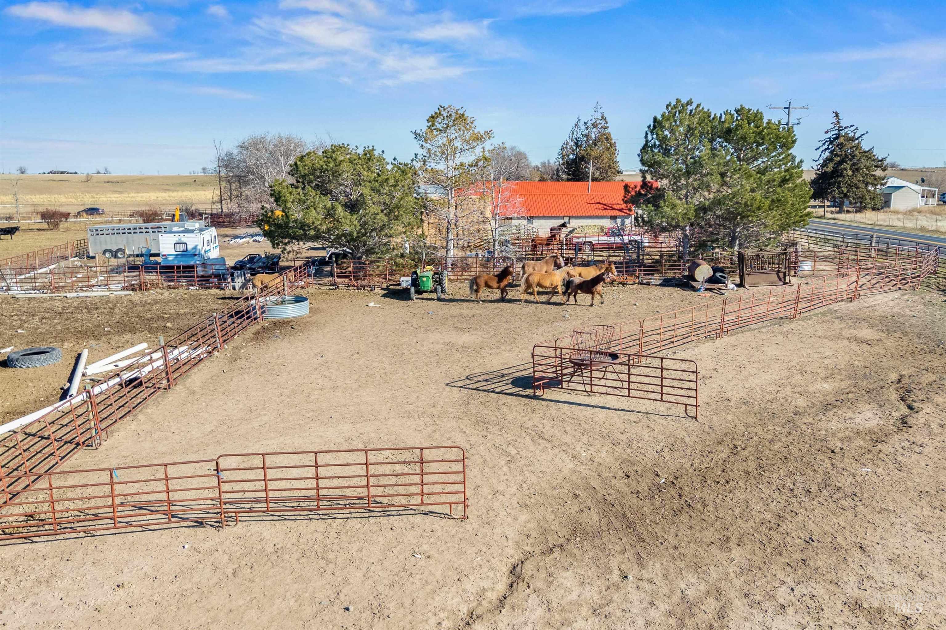 1898 East 3700th Street North Filer, ID 83328 - Photo 34 of 40 View of yard featuring a rural view, an enclosed horse arena, and an exterior structure