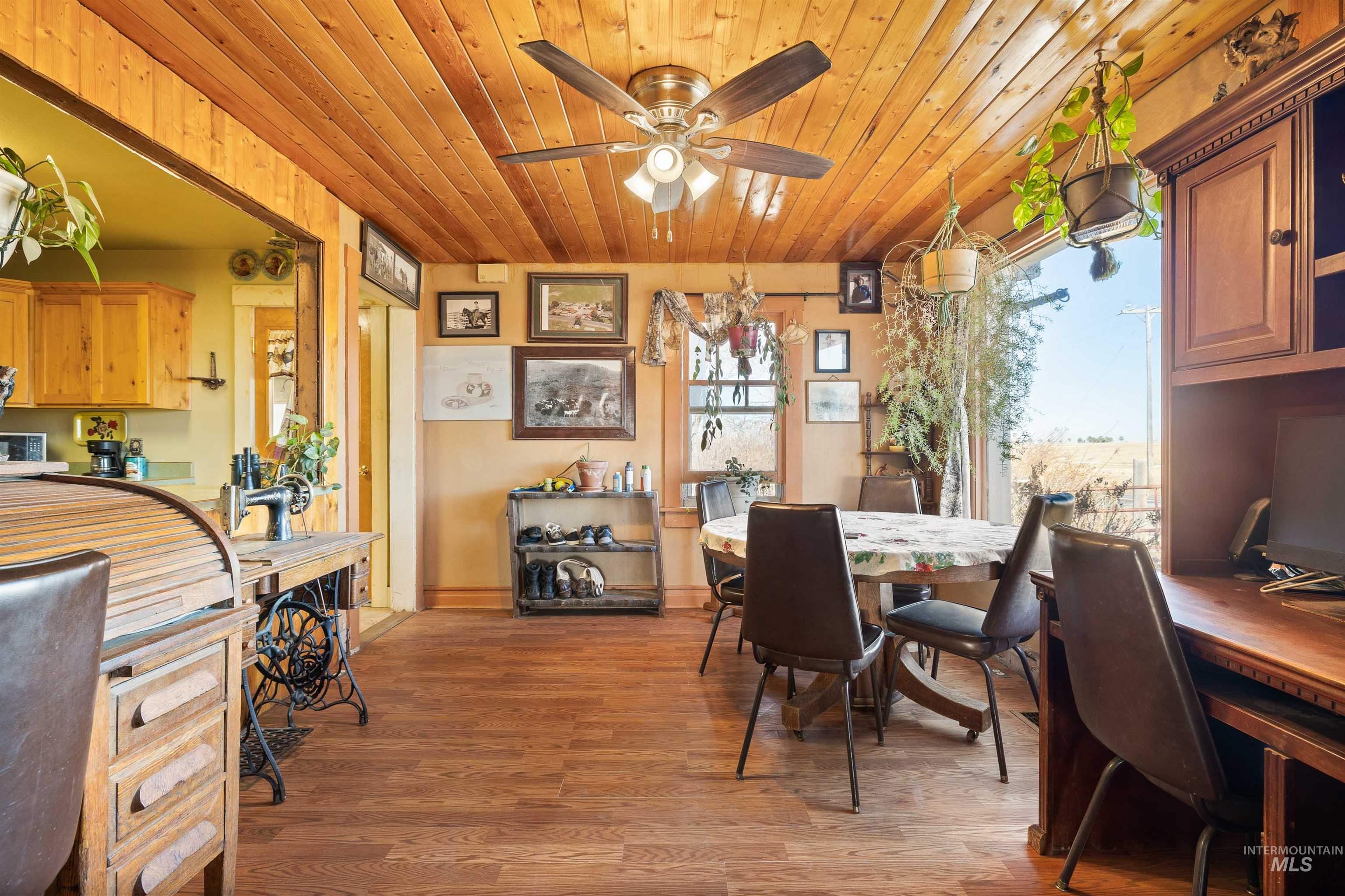 1898 East 3700th Street North Filer, ID 83328 - Photo 7 of 40 Dining space featuring a ceiling fan, wood finished floors, and wood ceiling