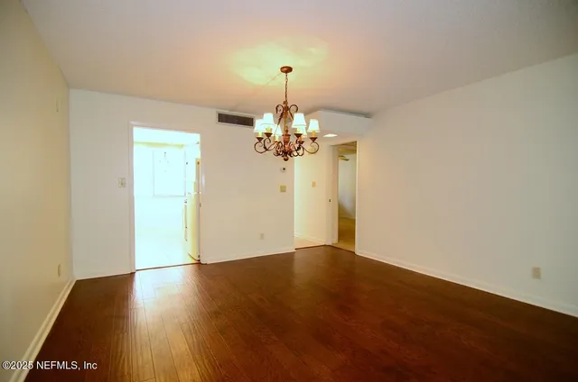 a bathroom with a sink a mirror and a shower
