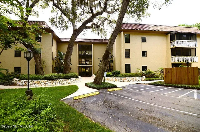 a living room with furniture and a gate
