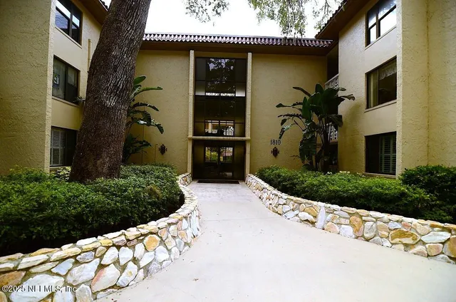 an aerial view of a multi story residential apartment building
