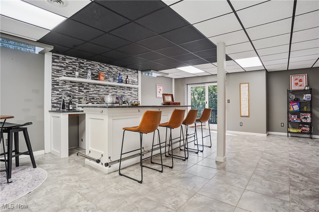 370 Wilcox Road Youngstown, OH 44515 - Photo 33 of 49 Indoor wet bar with a drop ceiling and backsplash
