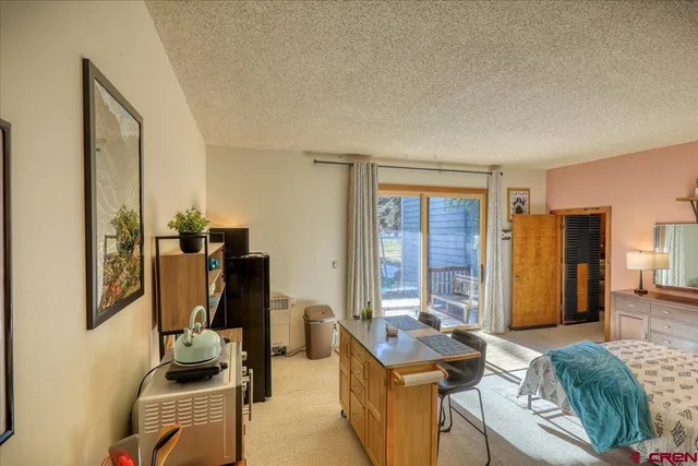 a view of a kitchen with appliances and cabinets