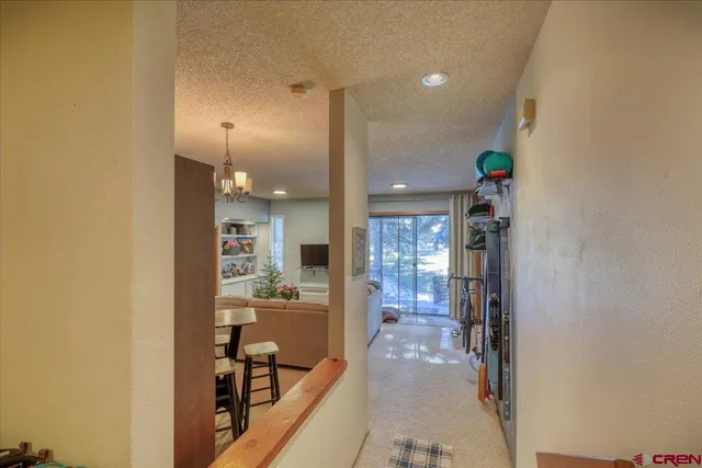 a view of a livingroom with furniture window and wooden floor