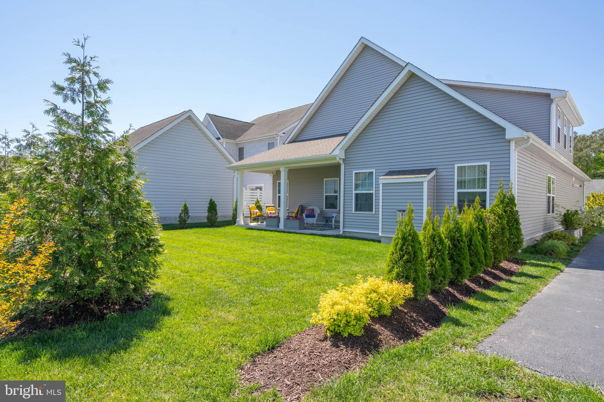 12159 Snug Harbor Road Berlin, MD 21811 - Photo 39 of 72 a view of a house with a yard and potted plants