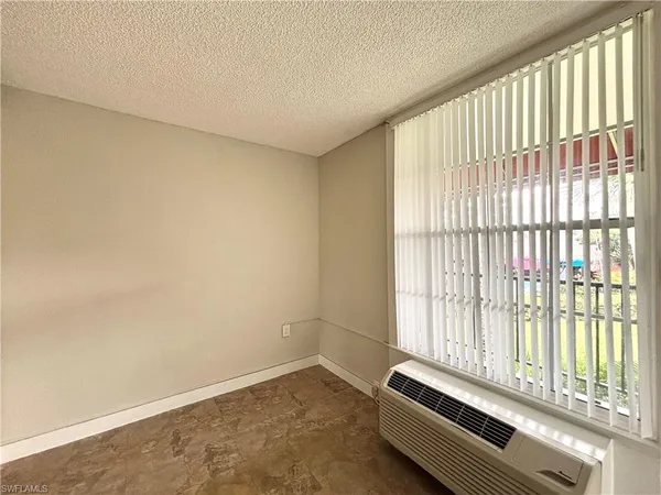 a room with a bed and a window