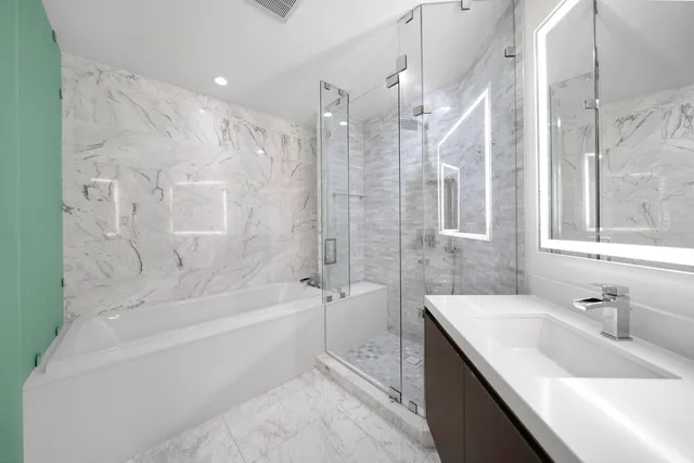 a bathroom with a bathtub and a sink