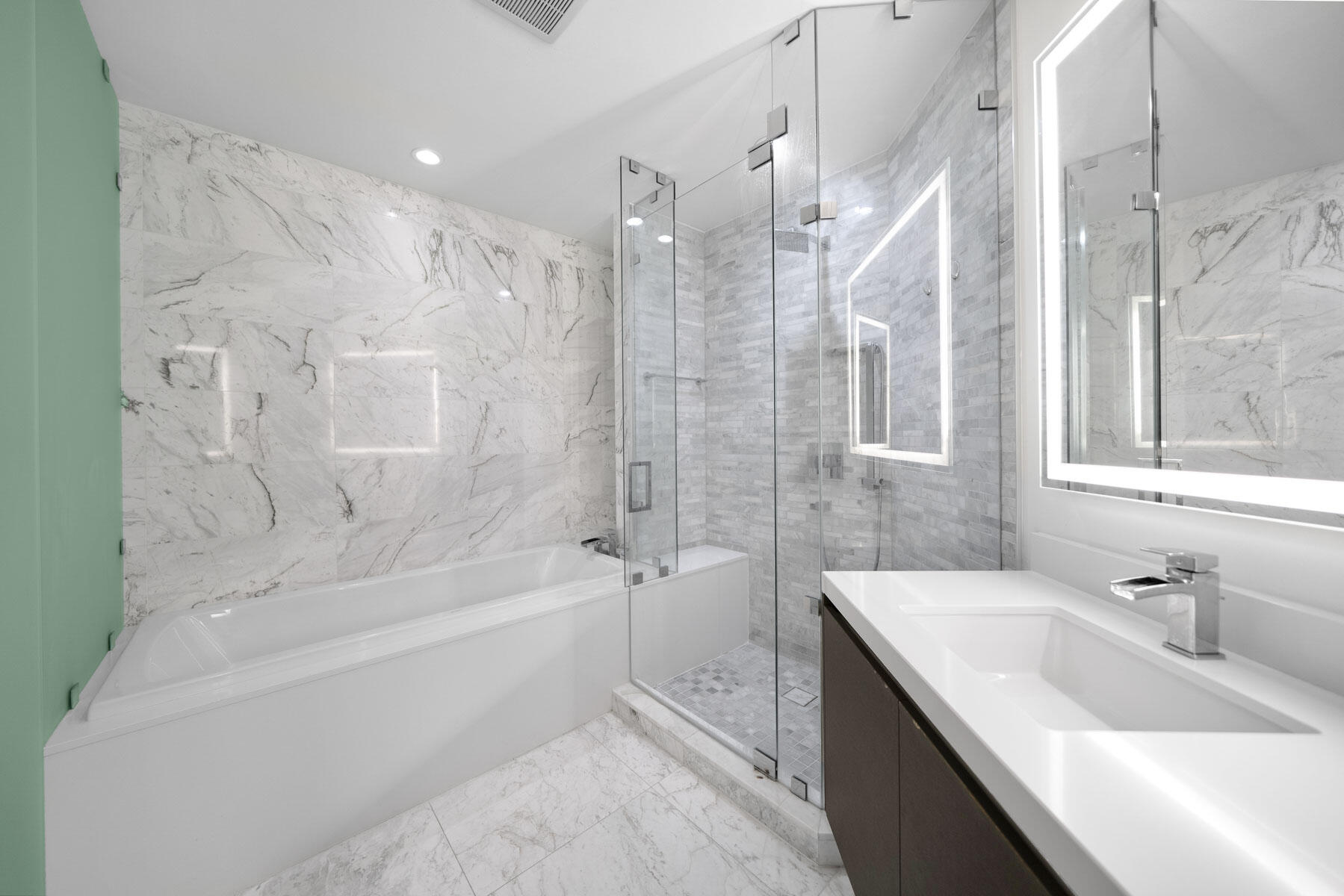 851 Northeast 1st Avenue, Unit 2410 Miami, FL 33132 - Photo 11 of 27 a bathroom with a bathtub and a sink