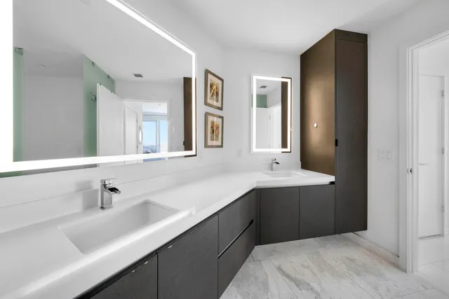 a en suite bathroom with a sink and mirror