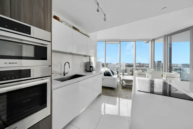 a kitchen with a stove a sink and a microwave