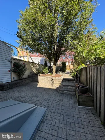 a view of backyard with outdoor seating