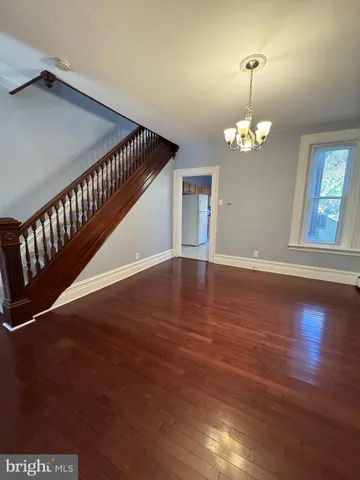 a view of livingroom with hardwood floor and hallway