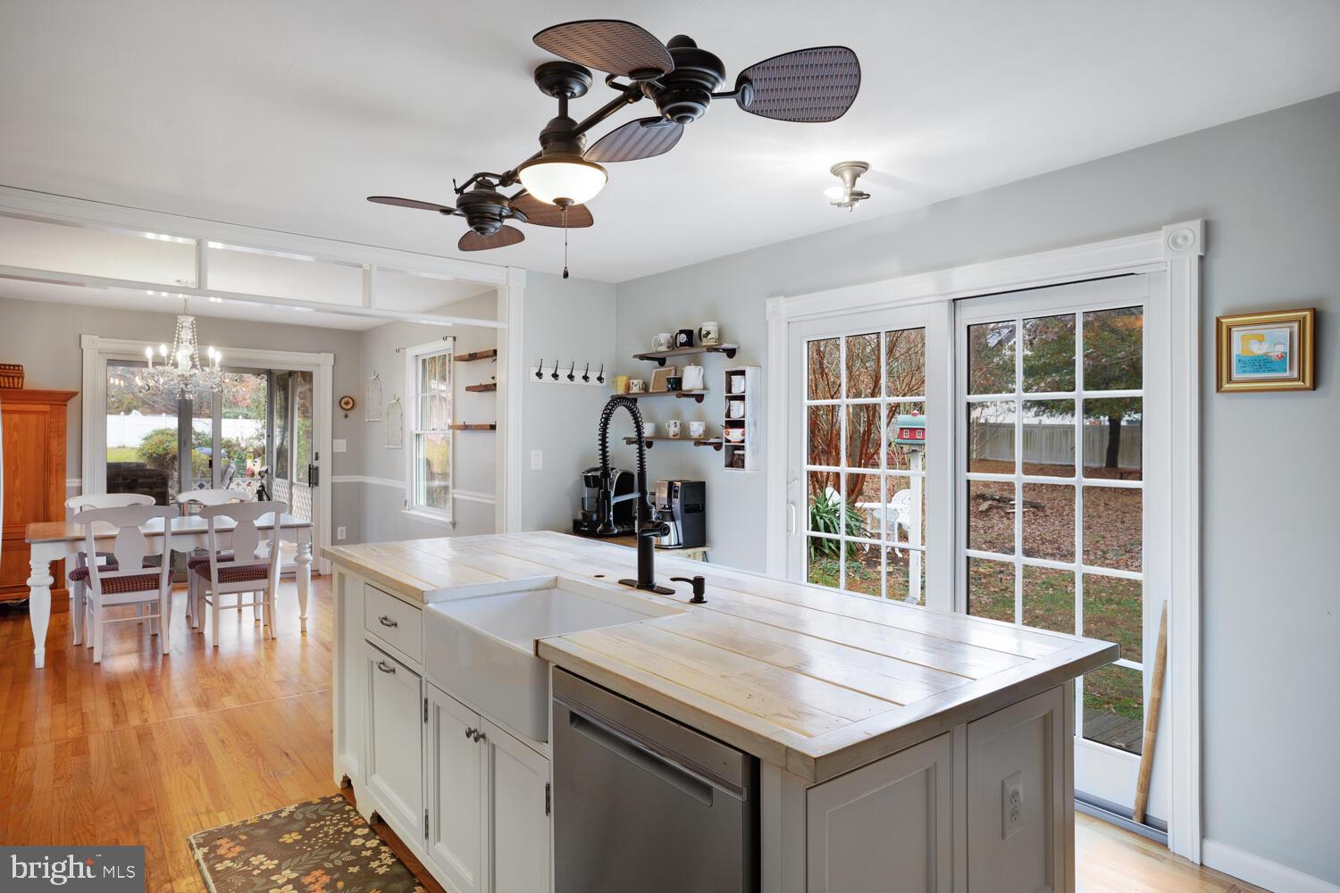 111 Mathis Drive Little Egg Harbor, NJ 08087 - Photo 12 of 38 a kitchen with a table chairs and a chandelier