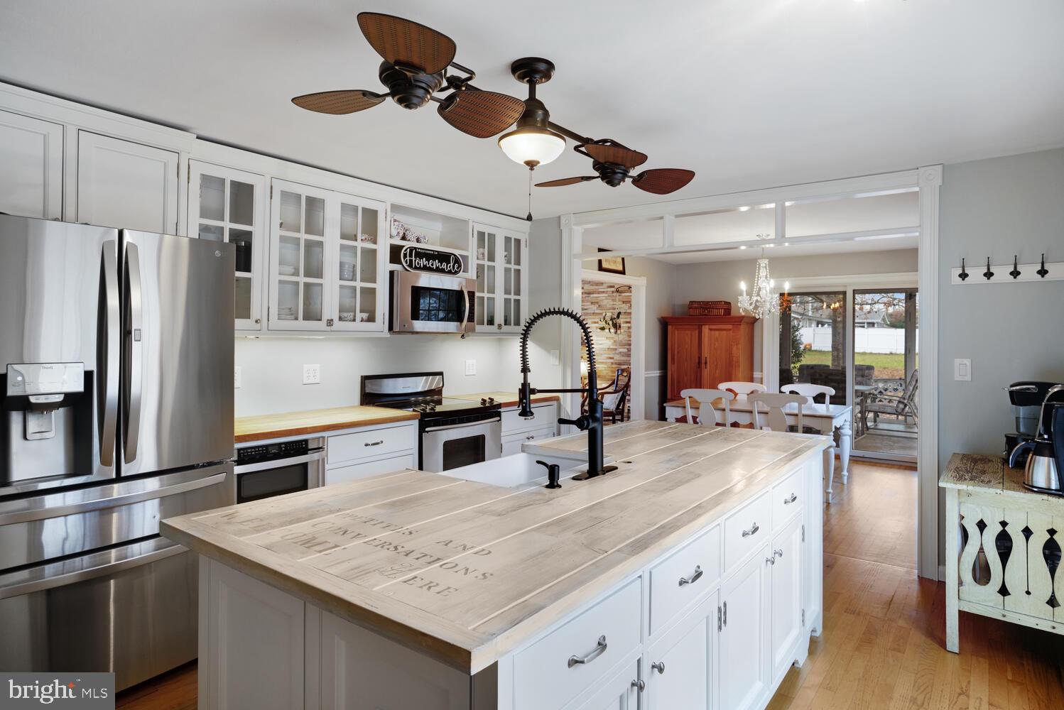 111 Mathis Drive Little Egg Harbor, NJ 08087 - Photo 13 of 38 a kitchen with stainless steel appliances granite countertop a sink and refrigerator