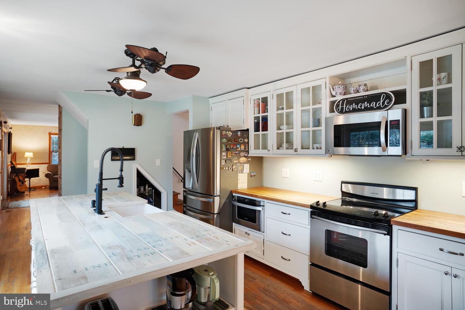 111 Mathis Drive Little Egg Harbor, NJ 08087 - Photo 14 of 38 a kitchen with stainless steel appliances granite countertop a stove and a refrigerator