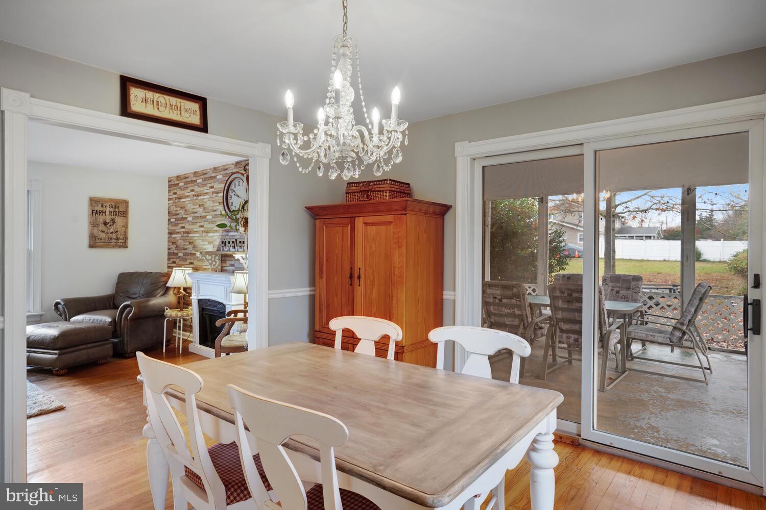 111 Mathis Drive Little Egg Harbor, NJ 08087 - Photo 17 of 38 a view of a dining room with furniture a chandelier and window
