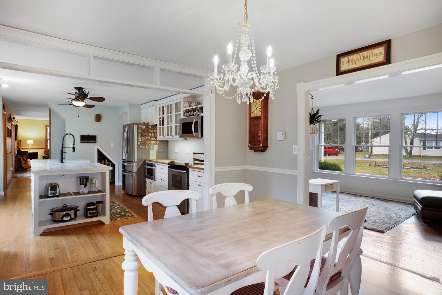 111 Mathis Drive Little Egg Harbor, NJ 08087 - Photo 18 of 38 a living room with furniture and a chandelier