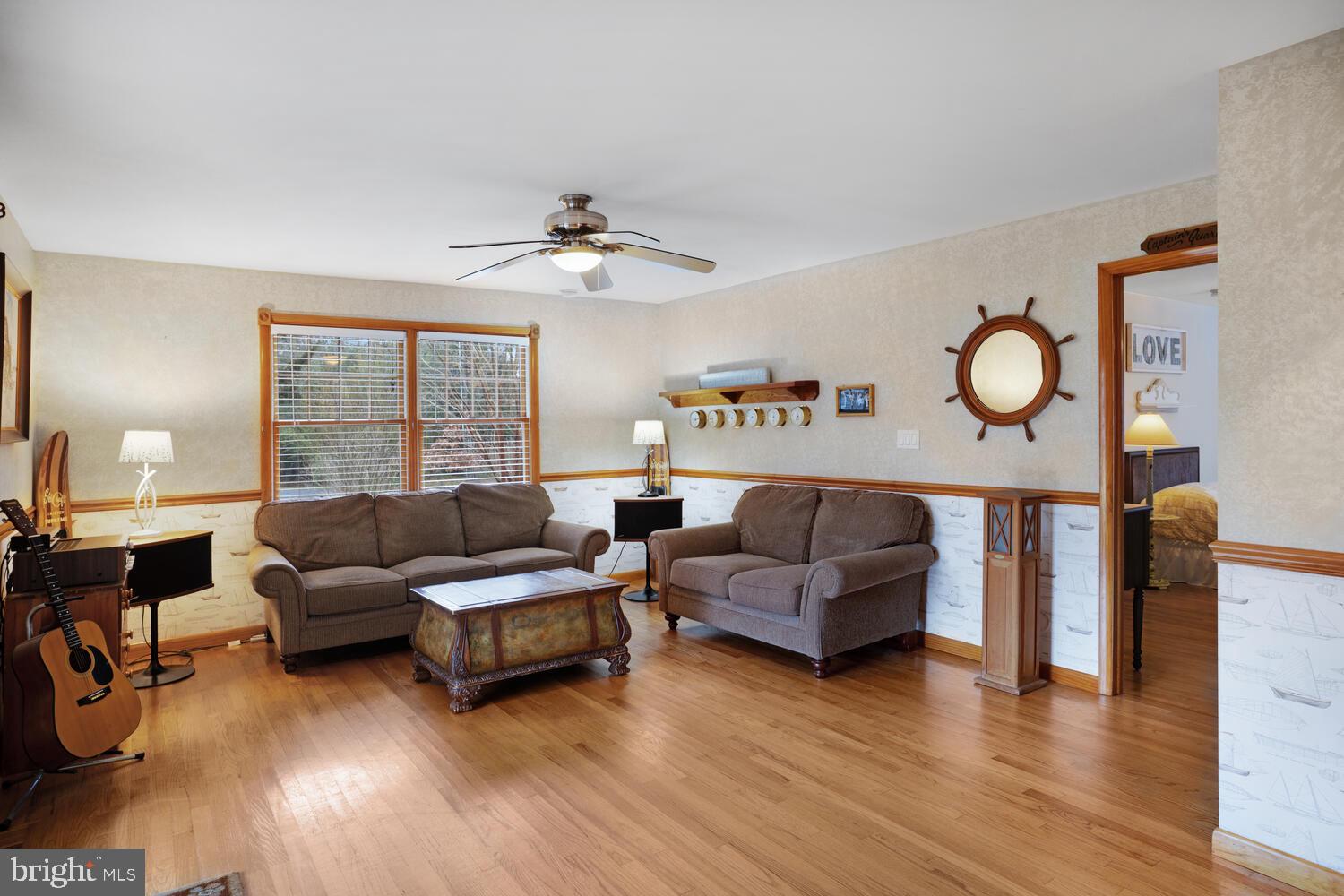 111 Mathis Drive Little Egg Harbor, NJ 08087 - Photo 21 of 38 a living room with furniture and a wooden floor