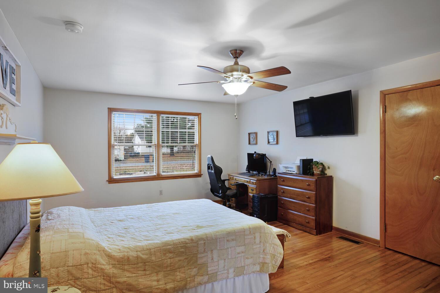 111 Mathis Drive Little Egg Harbor, NJ 08087 - Photo 25 of 38 a bedroom with a bed and a flat screen tv