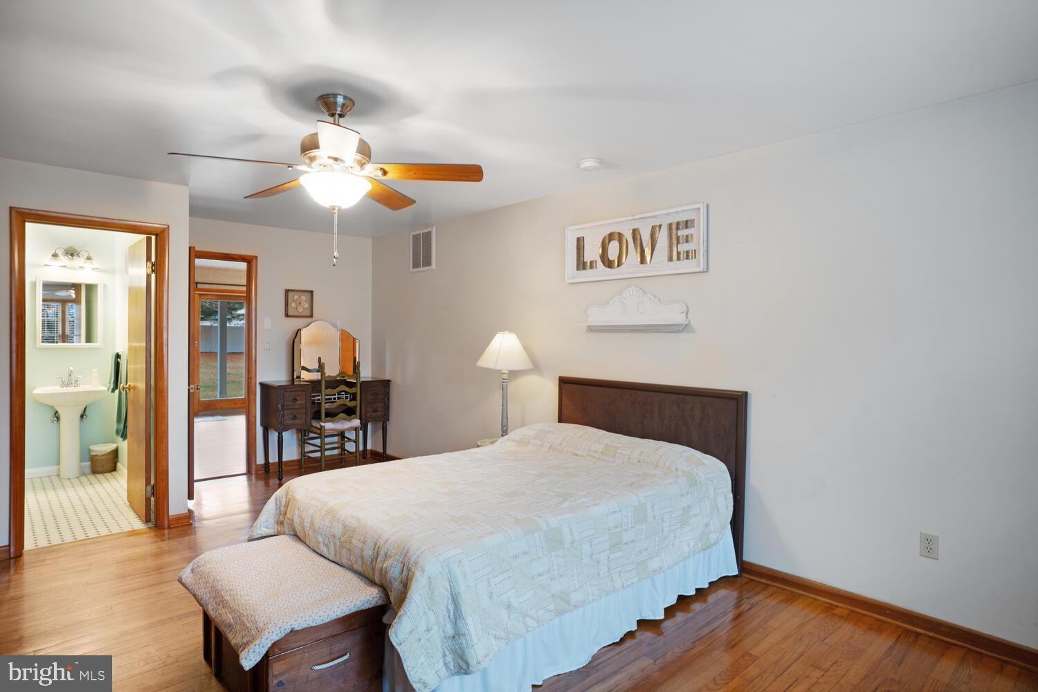 111 Mathis Drive Little Egg Harbor, NJ 08087 - Photo 26 of 38 a bedroom with a bed and wooden floor