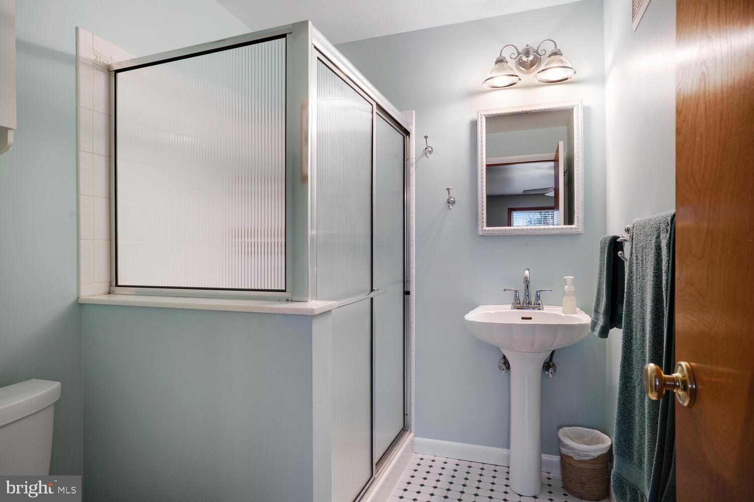 111 Mathis Drive Little Egg Harbor, NJ 08087 - Photo 27 of 38 a bathroom with a sink a toilet and mirror