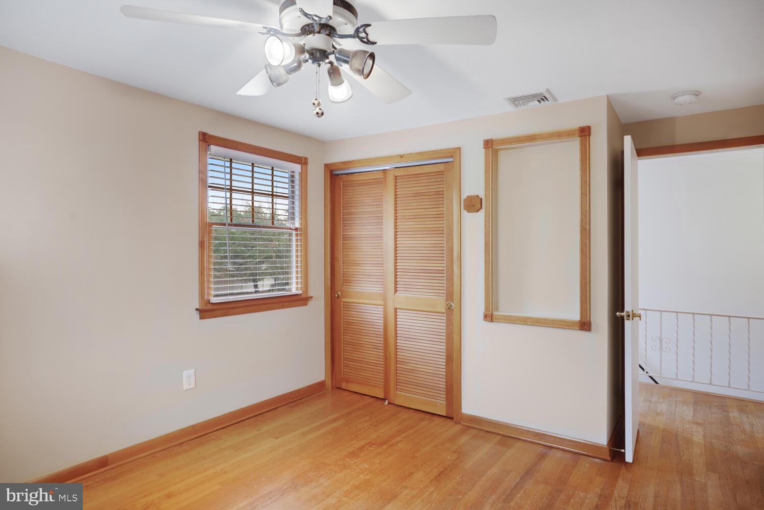 111 Mathis Drive Little Egg Harbor, NJ 08087 - Photo 29 of 38 a view of an empty room with a window and wooden floor