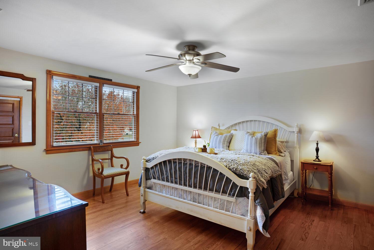 111 Mathis Drive Little Egg Harbor, NJ 08087 - Photo 30 of 38 a bedroom with a bed window and a chair