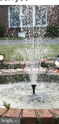 a view of outdoor space with water fountain