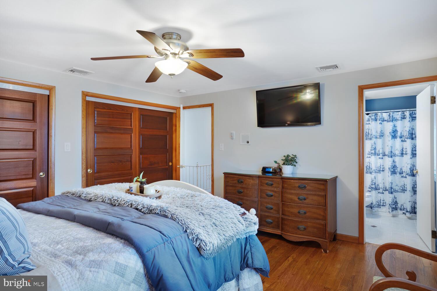 111 Mathis Drive Little Egg Harbor, NJ 08087 - Photo 31 of 38 a bedroom with a bed and a flat screen tv