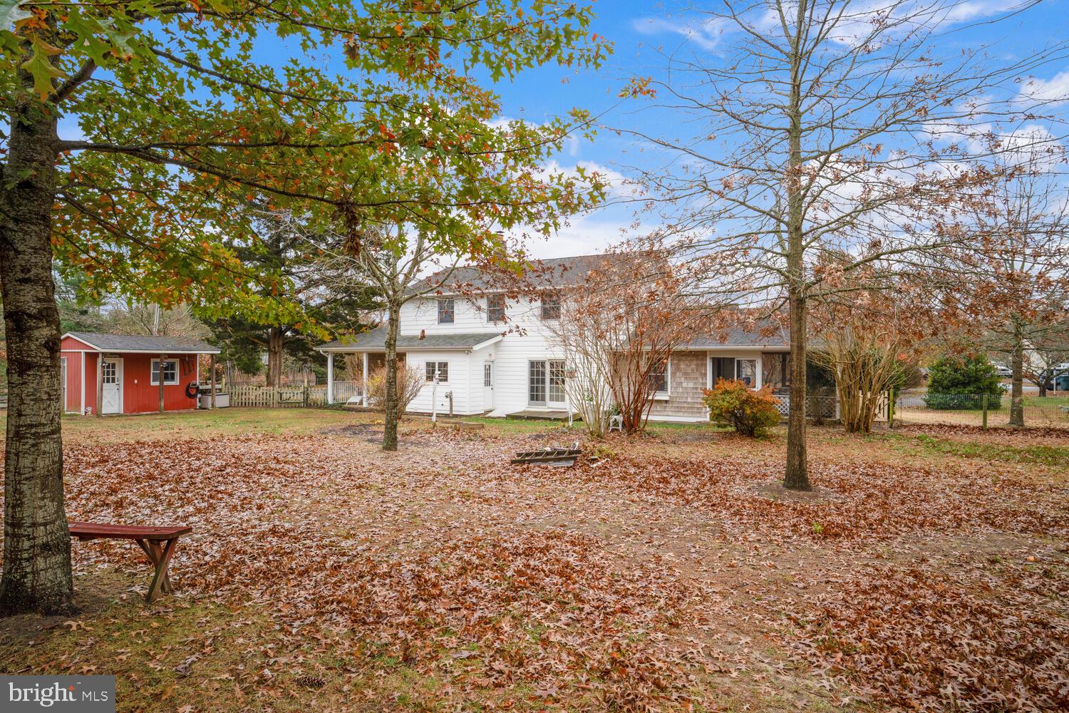 111 Mathis Drive Little Egg Harbor, NJ 08087 - Photo 4 of 38 a tree in front of a white house