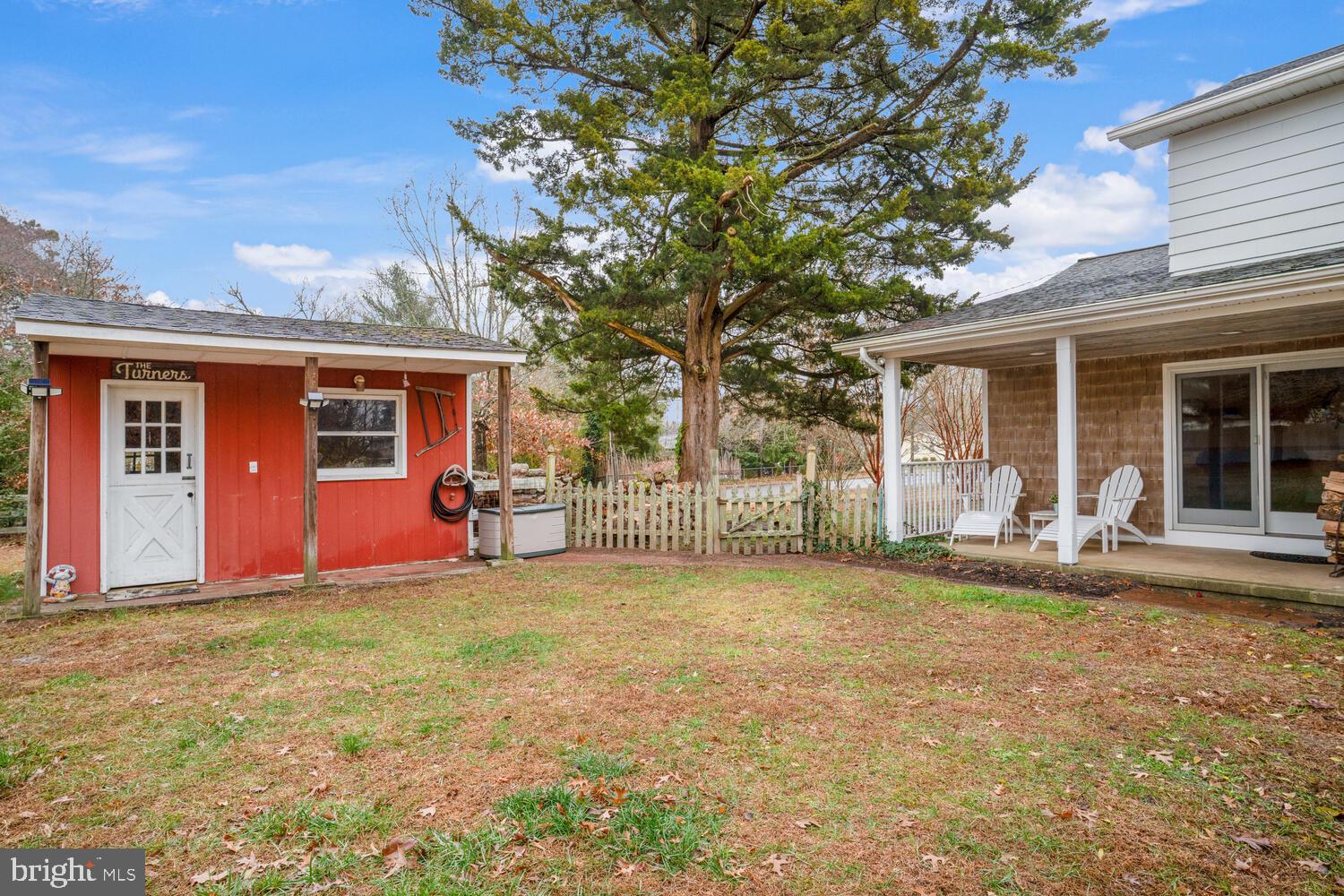 111 Mathis Drive Little Egg Harbor, NJ 08087 - Photo 5 of 38 a view of a house with backyard porch and sitting area