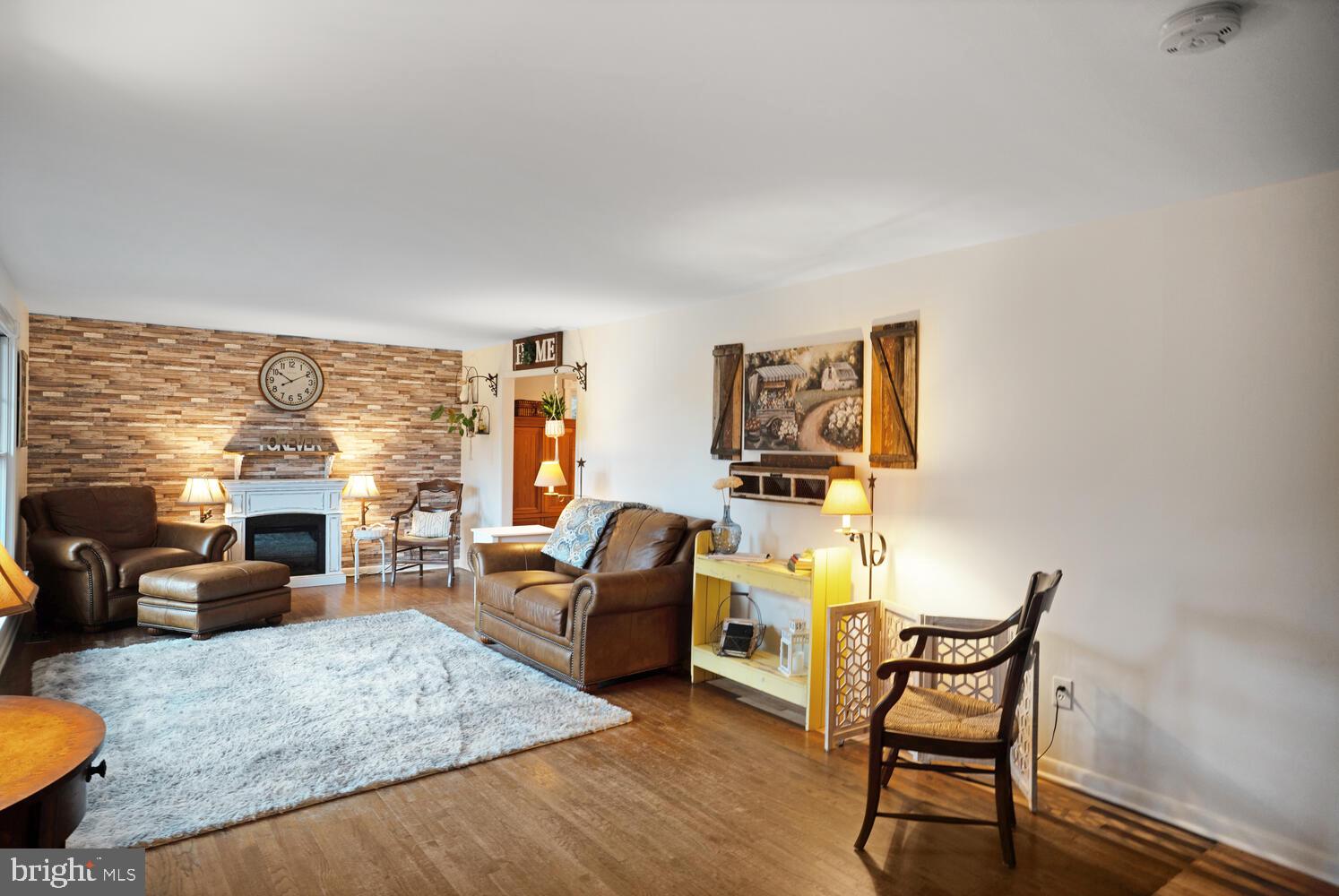 111 Mathis Drive Little Egg Harbor, NJ 08087 - Photo 7 of 38 a living room with furniture and a large window