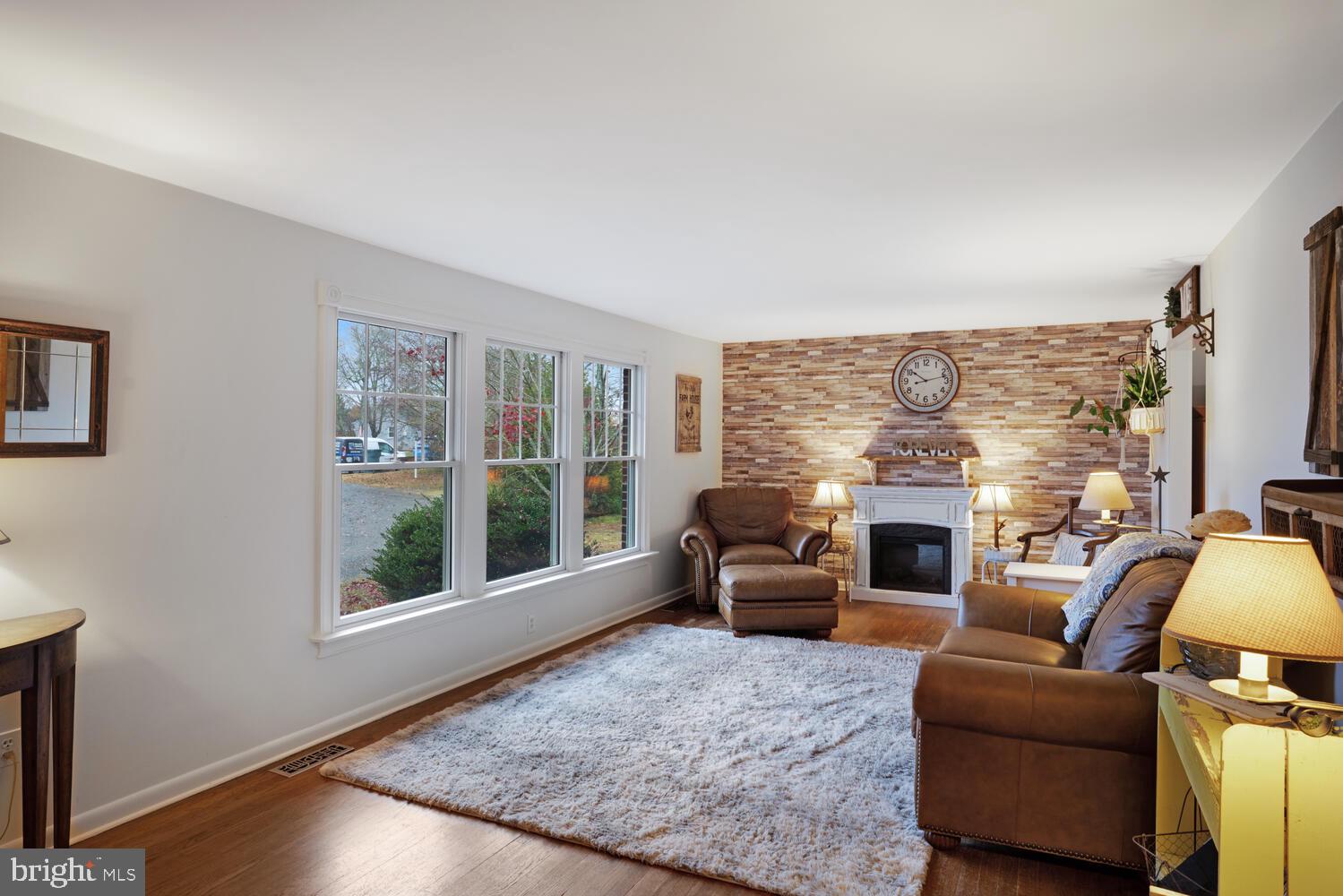 111 Mathis Drive Little Egg Harbor, NJ 08087 - Photo 10 of 38 a living room with furniture windows and a fireplace