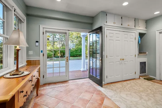 a view of kitchen with furniture and refrigerator