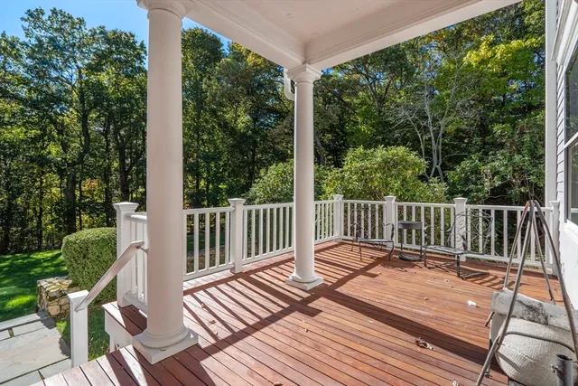 a balcony with wooden floor in outdoor space
