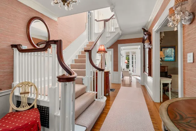 a very nice looking bedroom with a large bed and a chandelier